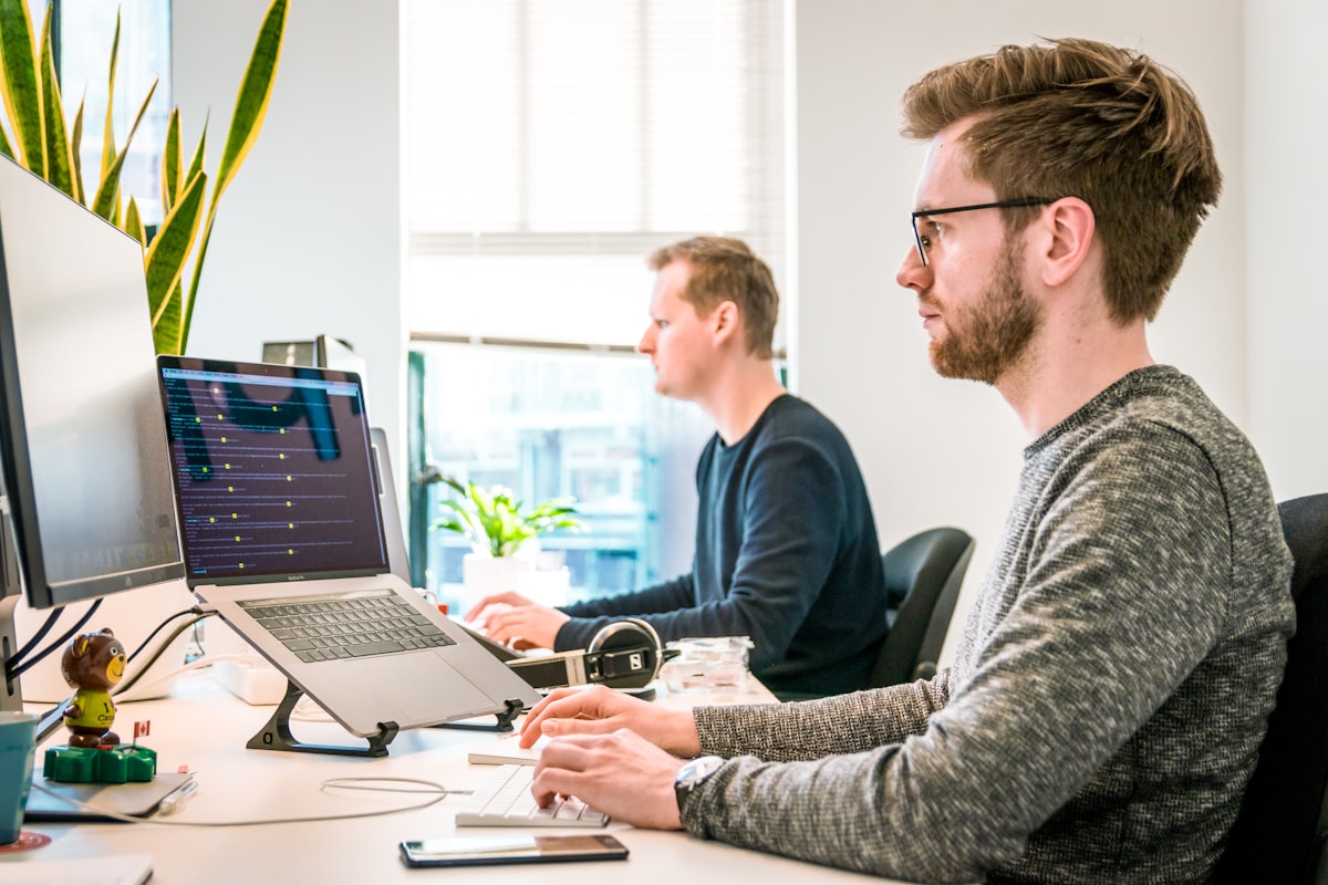 Multiple monitors displaying analytics dashboards with charts and graphs