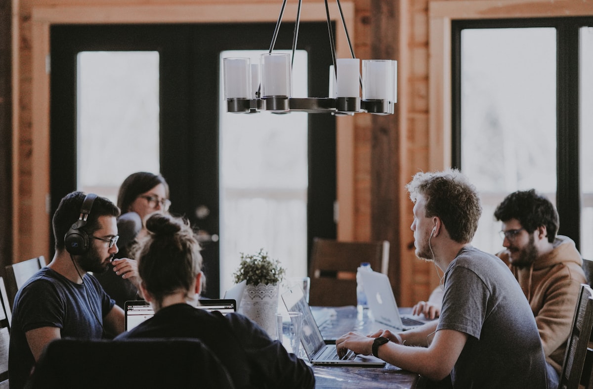 A project lead presenting a revised workflow to a cross-functional team